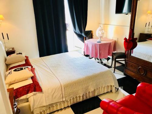 Katil atau katil-katil dalam bilik di B&B dell'orologio