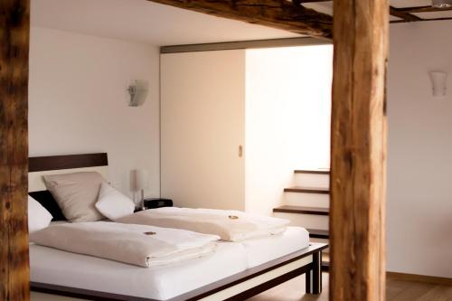 En eller flere senge i et værelse på Wein-Domizil Brennofen