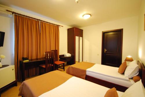 Ένα ή περισσότερα κρεβάτια σε δωμάτιο στο Casa iRMA - Rooms for rent