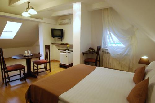 Ένα ή περισσότερα κρεβάτια σε δωμάτιο στο Casa iRMA - Rooms for rent