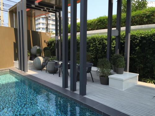 a patio with a swimming pool on a building at Budget 2 bedrooms Apartment in Huahin in Hua Hin