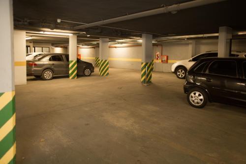 a parking garage with cars parked in it at Neper Hotel in Cordoba
