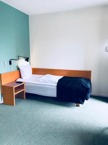 Postel nebo postele na pokoji v ubytování Hotel Garni