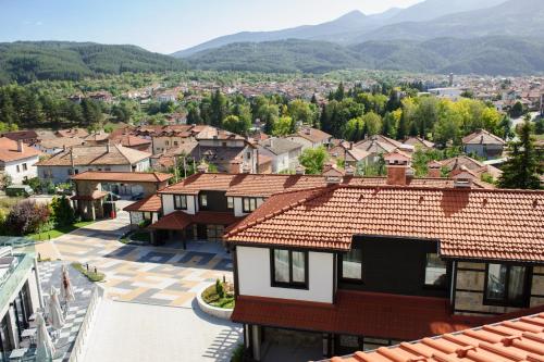 an overhead view of a town with houses and mountains at Ruskovets Thermal SPA & Ski Resort in Bansko
