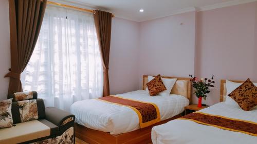 Giường trong phòng chung tại Fancy Sapa Hostel 2