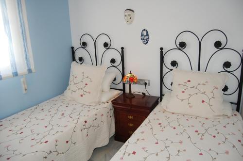 Ein Bett oder Betten in einem Zimmer der Unterkunft Apartment Fuentes de Nerja