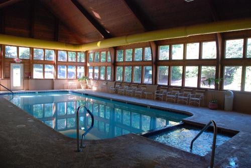 a large swimming pool with chairs in a building at Fox Run Association, a VRI resort in Lake Lure