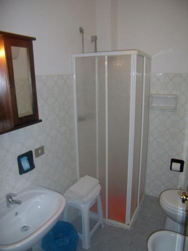 a bathroom with a shower and a sink and a toilet at Hotel Sangallo B&B - panoramic position - Valley and vineyard view- family run in Montepulciano