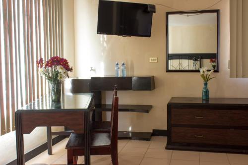 TV a/nebo společenská místnost v ubytování Villas Hotel Cholula