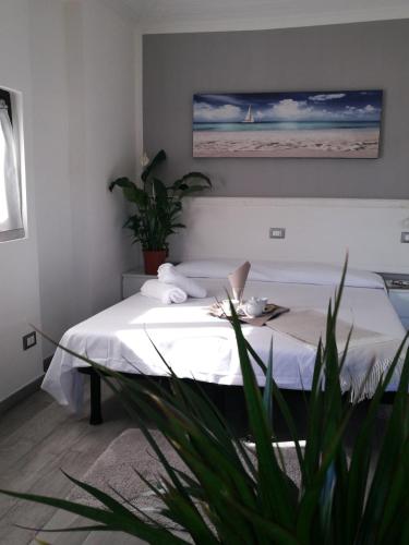 a bedroom with a bed with a laptop on it at IRON GATE MARINA3B in Sarzana