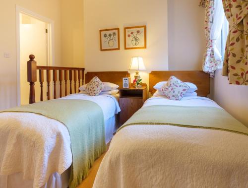Ένα ή περισσότερα κρεβάτια σε δωμάτιο στο Roseleigh House