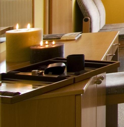 a counter with two candles on top of a table at Landhaus Luka in Mörbisch am See