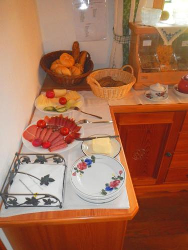 a kitchen counter with plates of food on it at BIO-Bergbauernhof Ederhias in Liesing