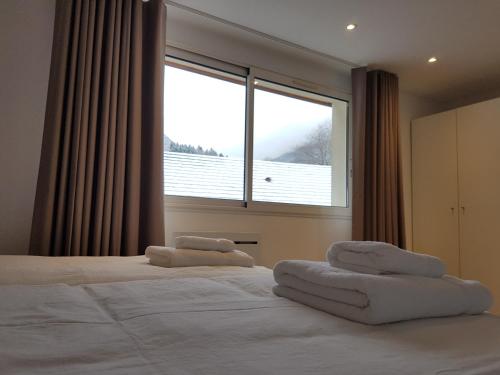 En eller flere senge i et værelse på Lac et Montagne