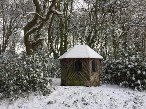 a small bird house with snow on top of it at The Wrea Head Hall Country House Hotel & Restaurant in Scarborough