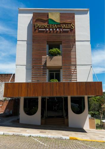 a building with a sign on the front of it at Hotel Princesa dos Vales in Veranópolis