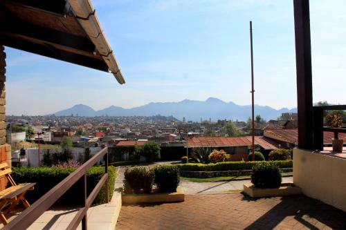 a view of the city from the roof of a house at Hotel y Cabañas una Cosita de Zacatlán in Zacatlán