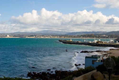 a view of the ocean with a pier and a beach at Monterey Bay Inn in Monterey