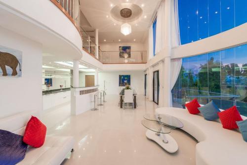 a large living room with red and blue pillows at White Stone - Luxurious Sunset View 4 Bed Pool Villa in Nathon