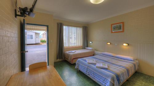 Ένα ή περισσότερα κρεβάτια σε δωμάτιο στο Dubbo Midstate Motor Park