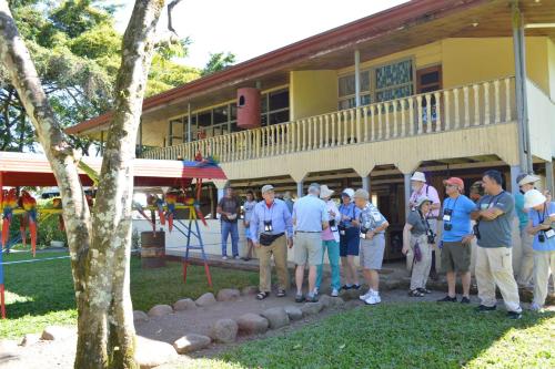a group of people standing in front of a building at Finca Dos Calaveras in Ángeles