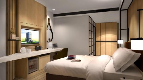 a bedroom with a white bed and a fireplace at Novotel Karawang in Karawang