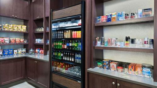a store with a refrigerator filled with lots of drinks at Hyatt Place Austin/Round Rock in Round Rock