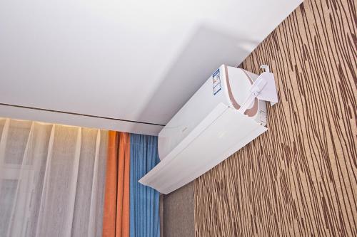 a white box is hanging from a ceiling at MG Hotel St Michael's Cathedral, Qingdao in Qingdao