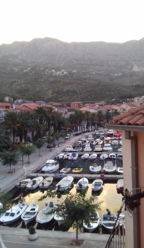 a bunch of boats parked in a parking lot at Studio with magic view in Podgora