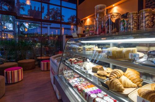 
a display case filled with lots of pastries at Srisuksant Resort in Ao Nang Beach
