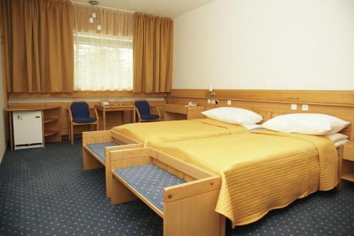 מיטה או מיטות בחדר ב-Hotel Špik