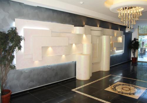a lobby with a large art installation on the wall at Le Caravelle Beirut in Beirut