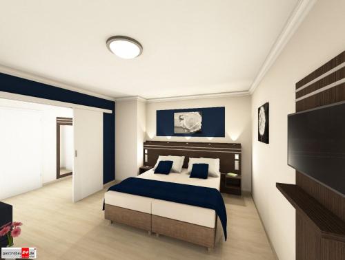 a bedroom with a bed with blue walls and a tv at Parkhotel Herne in Herne