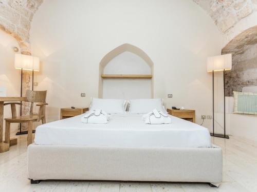 Кровать или кровати в номере La Sommità Relais & Chateaux