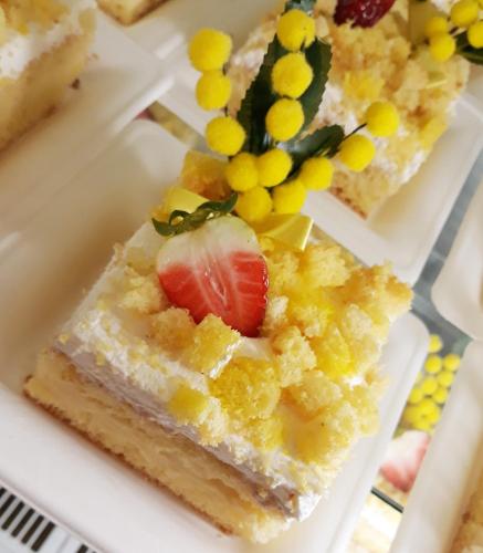 a piece of cake with a strawberry on top on a plate at Palazzo Bove in Galatone