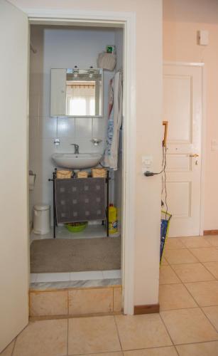 a bathroom with a sink and a toilet at Corfu Retreat in Corfu
