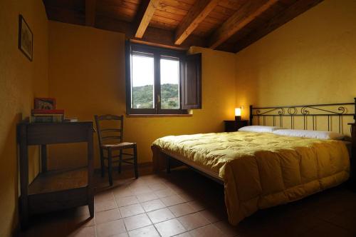 Un pat sau paturi într-o cameră la Residence Casa Torretta