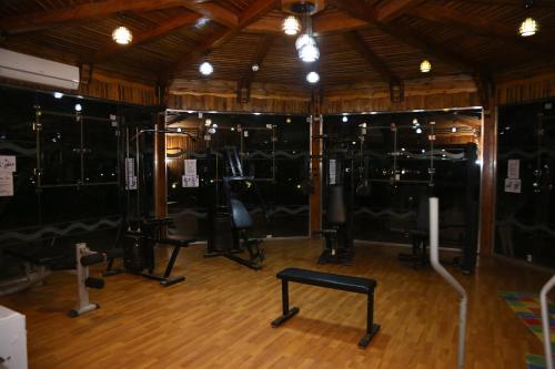 a gym with many different equipment in a room at Happy Life Village Dahab in Dahab