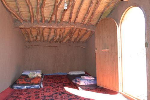 Giường trong phòng chung tại Nomadic Life Camp