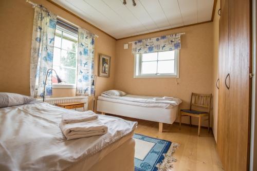 Postel nebo postele na pokoji v ubytování Nivagården