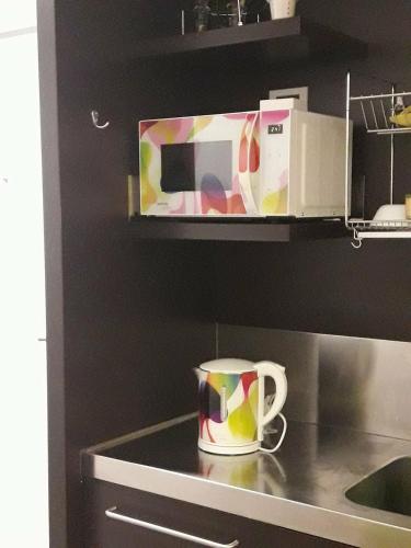 a coffee cup sitting on a counter in a kitchen at Apartma Kurji vrh - Chicken top in Kranjska Gora