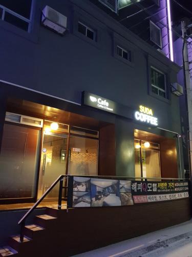 a store front of a building at night at Happy Q Motel in Andong