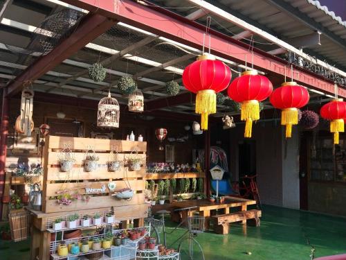 a store with red lanterns hanging from the ceiling at Taichung Xinshe Garden Life Homestay B&B in Xinshe