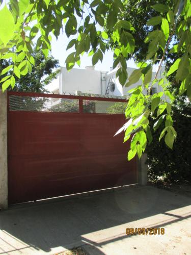 a brown garage door with a white appliance on top at HOTEL Boutique Casablanca Adrogué in Adrogué