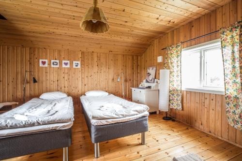 Postel nebo postele na pokoji v ubytování Nivagården