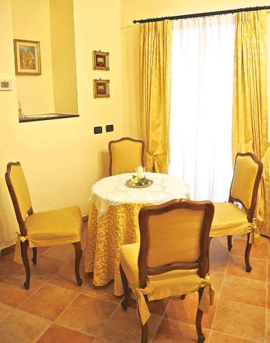 a dining room with a table and two chairs at Il Giardino Incantato in Monterosso al Mare