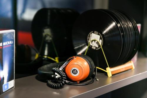 an orange phone sitting on a table next to a camera at arte Hotel Wien Stadthalle in Vienna