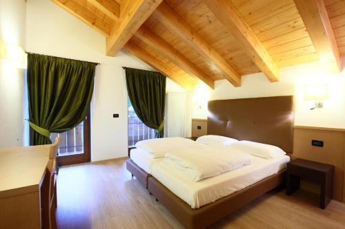 En eller flere senge i et værelse på Residence Al Lago