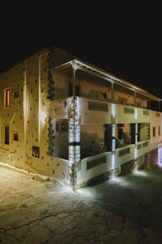 a rendering of a building at night at Viva Mare Studios in Astypalaia Town