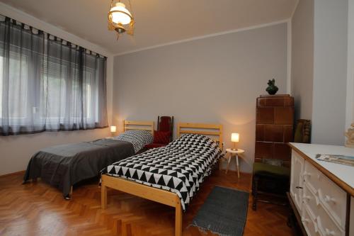 Кровать или кровати в номере Pietas Iulia